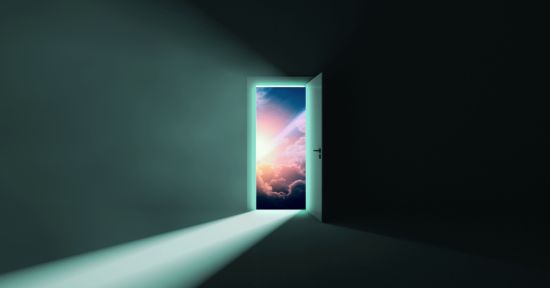 colorful sky visible through the only door in a dark room