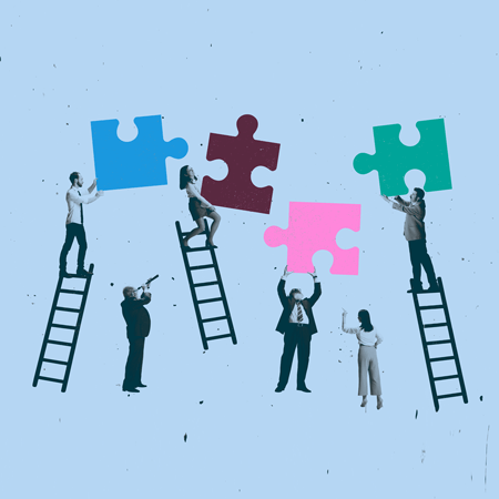 Businesspeople on ladders with colorful puzzle pieces