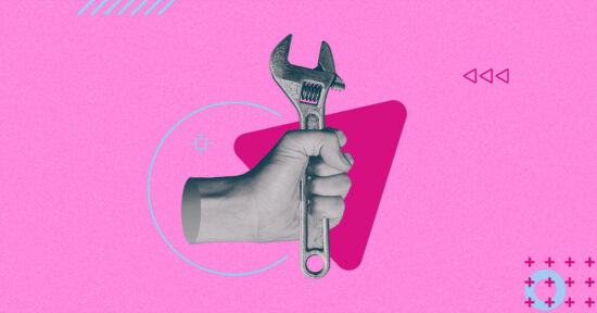 hand holding a wrench in a pink background