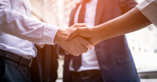 shaking hands - contracts insights post merger & acquisition